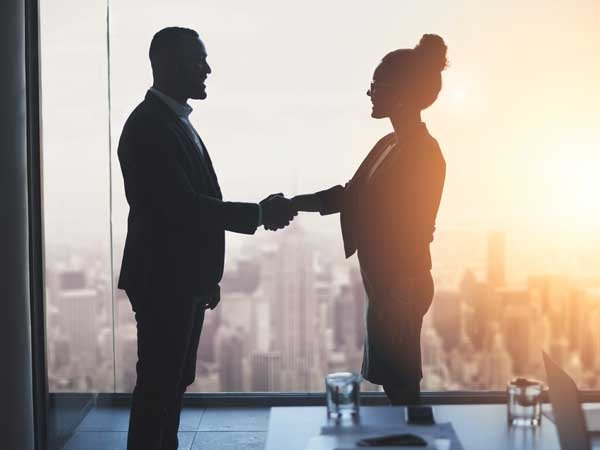 recruitment in surrey - man and woman shaking hands